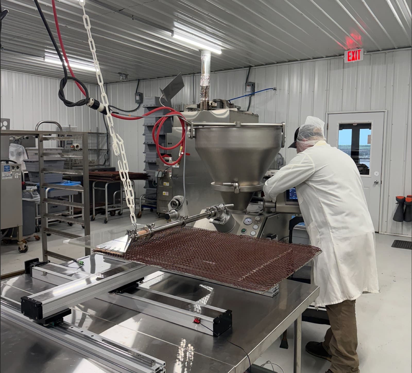 The Meat Bot on the production floor with the stuffer